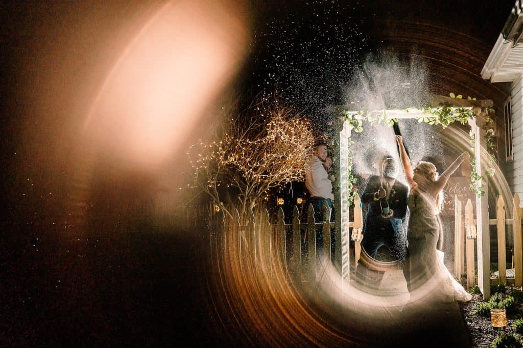 photograph from Wedding day timeline that included a champagne spray.