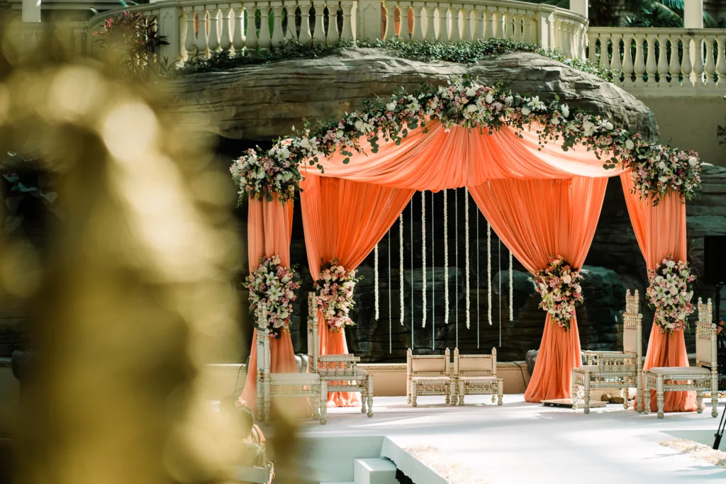 A ceremony with linen and floral designs in the Atrium at Gaylord Palms in Orlando.