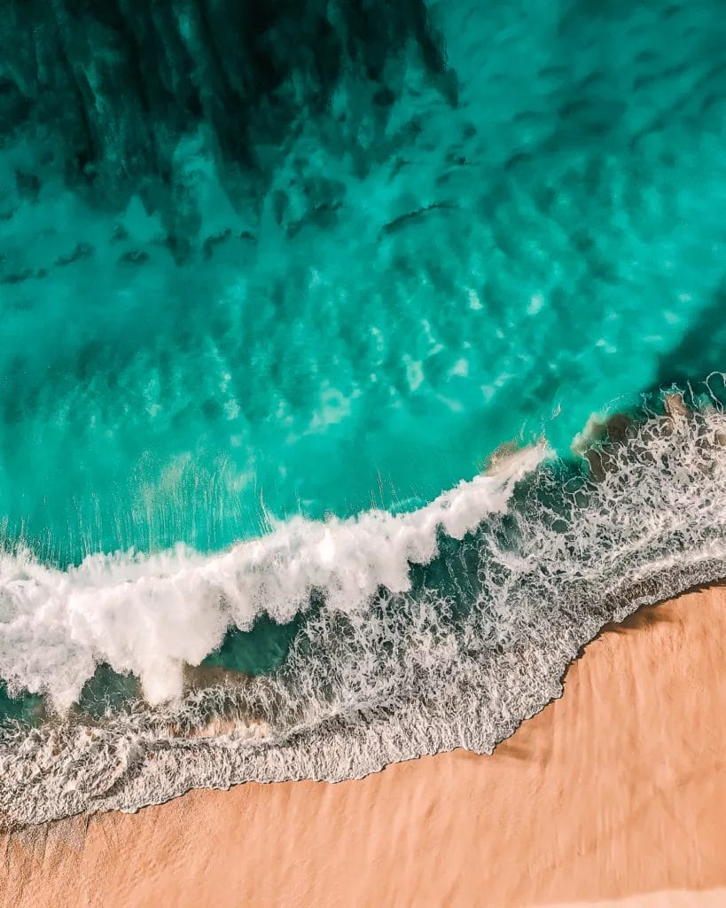 Waves crashing on a beach in Nassau Bahamas.