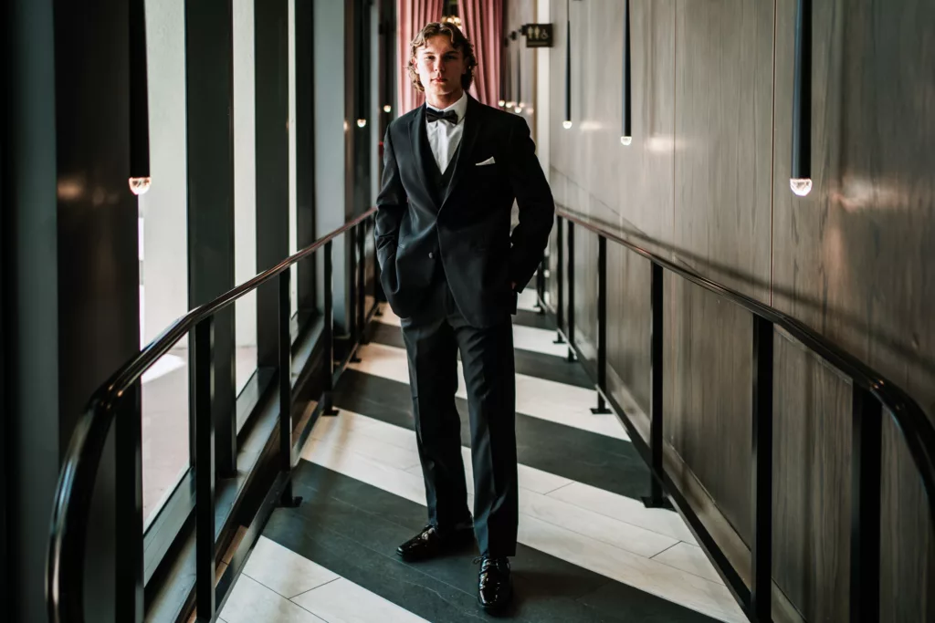 A groom in a hallway in a Miami Hotel