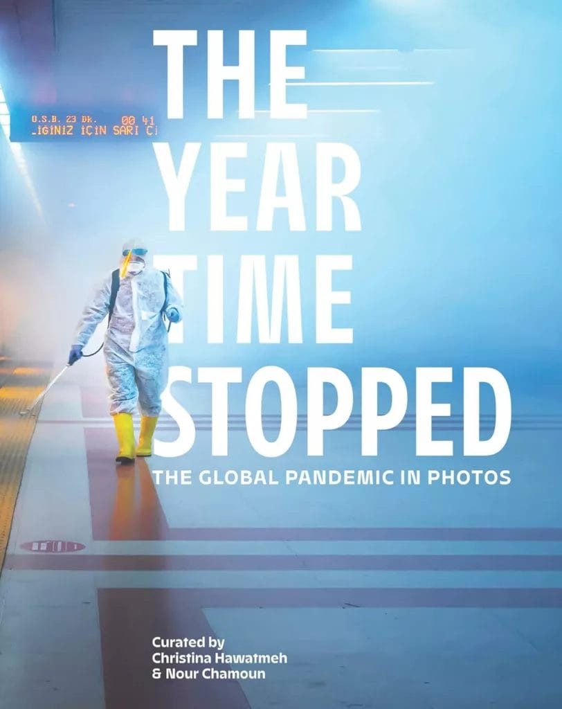Cover of the book "The year time stopped: the global pandemic in photos" which is a book you can buy on amazon.