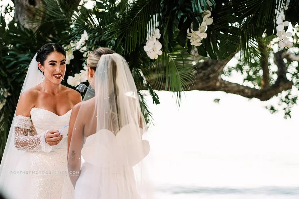 Bride looking at her bride on a destination wedding in the florida keys during the cermony. 