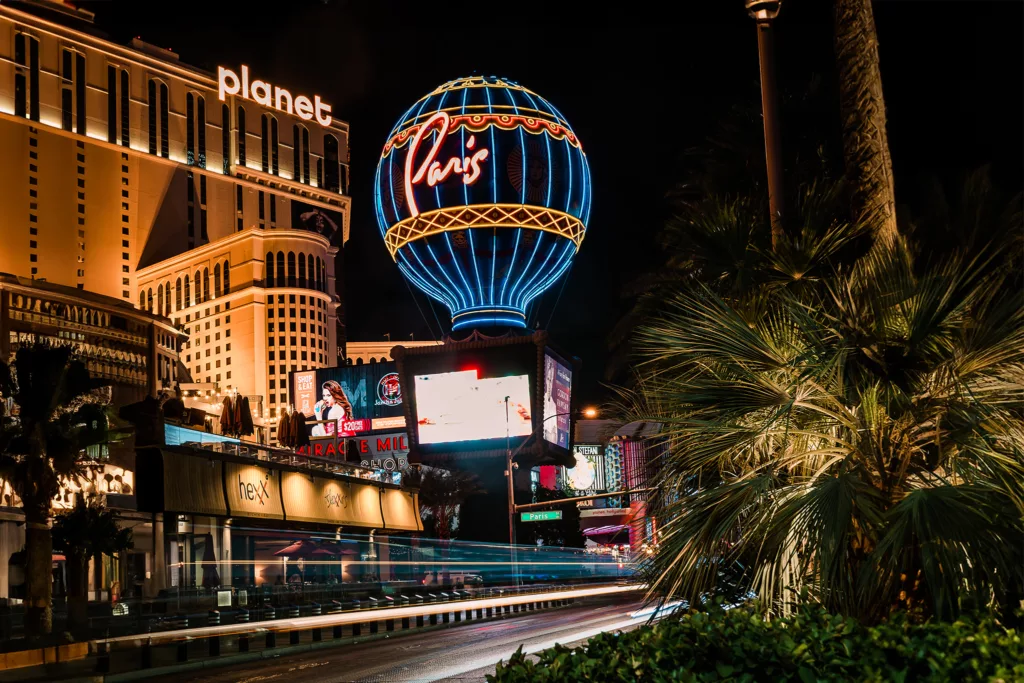 The Paris and Planet Hollywood hotels at night in Las Vegas