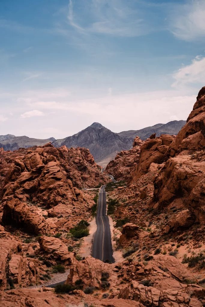 The view of the Valley of Fire State Park with a road leading to it. 