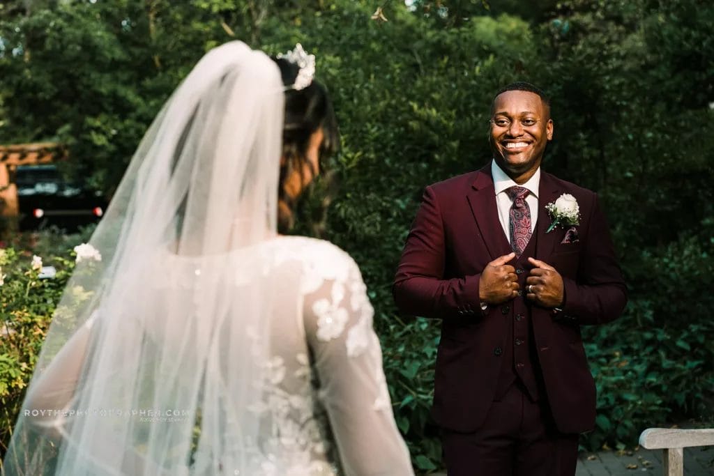 Groom seeing his bride for the first time during the first look. 