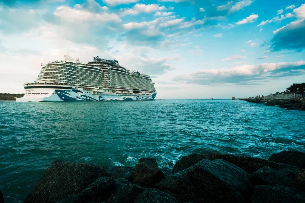How to Have a Destination Wedding in Belize 6 A royal caribbean cruise ship at sunset heading to belize.