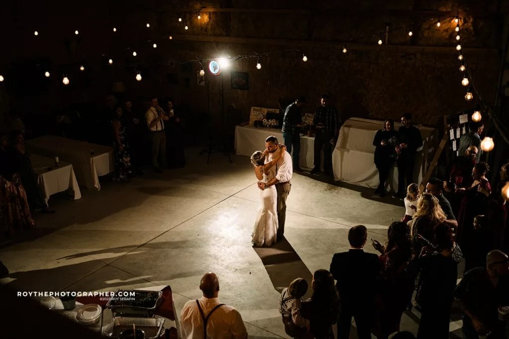 A couple doing thier first dance in a warehouse wedding