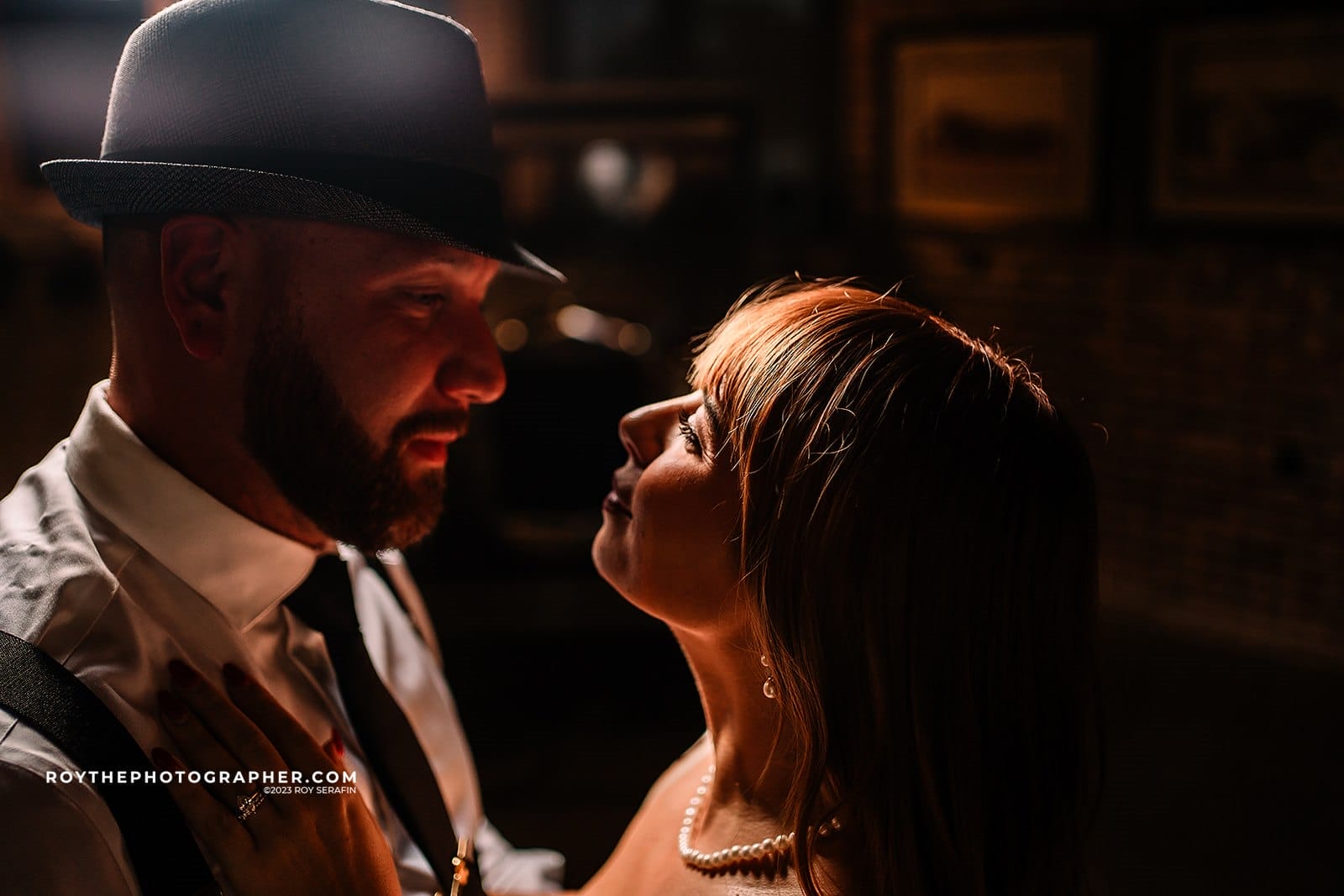 20+ Unique Wedding Venues in Jacksonville, FL 2 Couple gazing at each other in dim light.