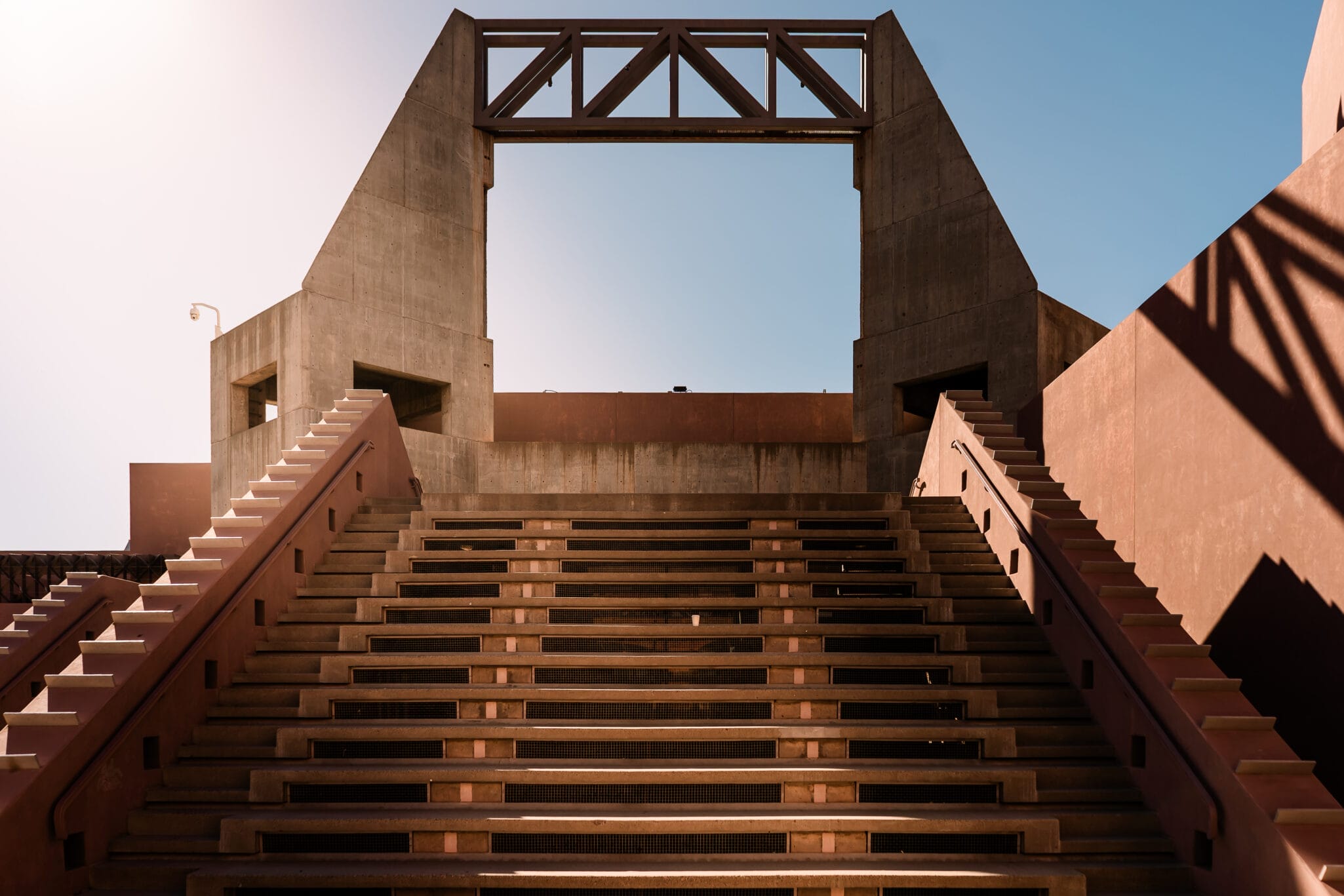 Phoenix Proposal Ideas and Places to Propose in Phoenix 19 Concrete staircase leading to a large framed opening, showcasing modern architectural design against a clear blue sky.